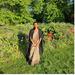 Student Loganathan standing in a field