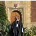 Full figure image of student Lawson in front of door in Jesus College College, Cambridge 