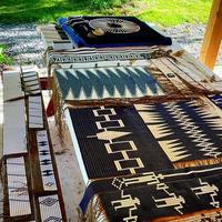 Textiles with geometrical motifs laid out on a table