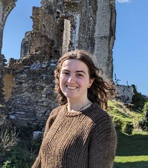 Photo of student Higham standing in a location that has historical significance