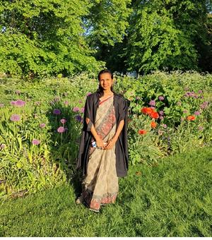 Student Loganathan standing in a field